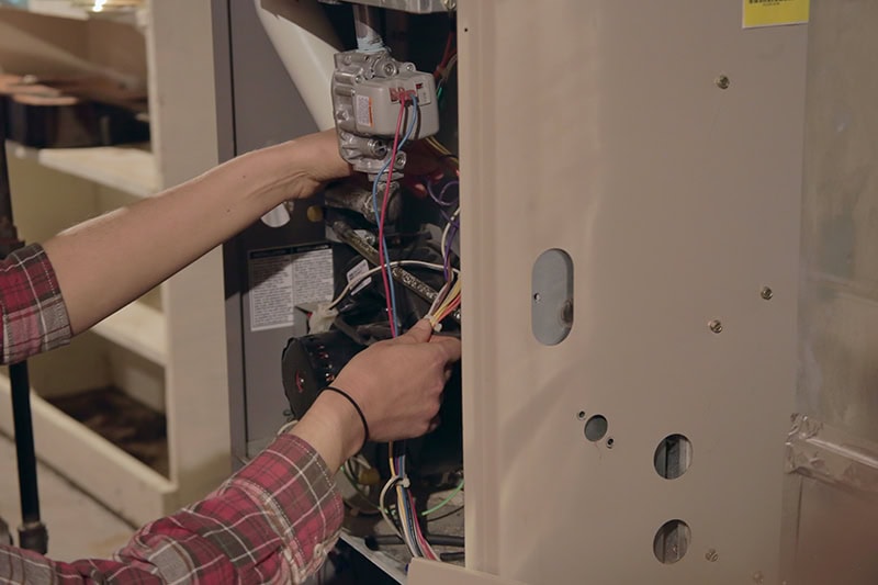 Service tech working on a HVAC unit.