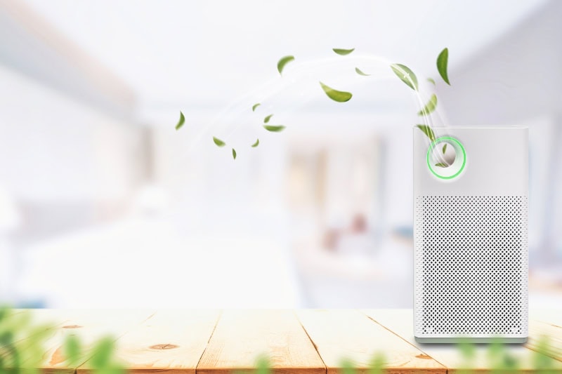 Air purifier a living room, air cleaner removing fine dust in house. protect PM 2.5 dust and air pollution concept.