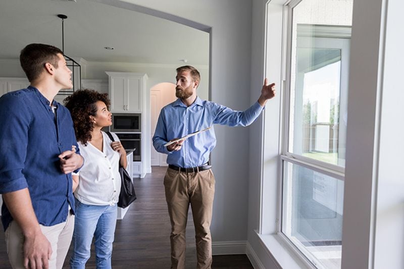 Image of couple being shown something. How Does Salt Air Affect Your Air Conditioner?